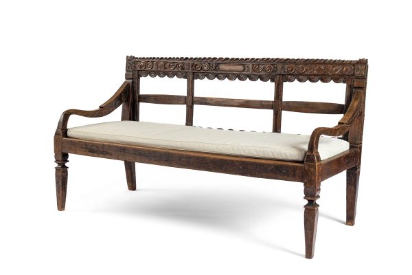 Wood Bench with carved back and white cushion - angled view