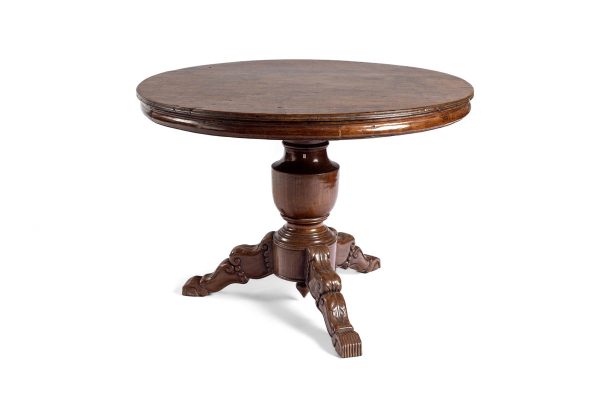 Antique pedestal table with delicately carved claw feet and Raffles edging